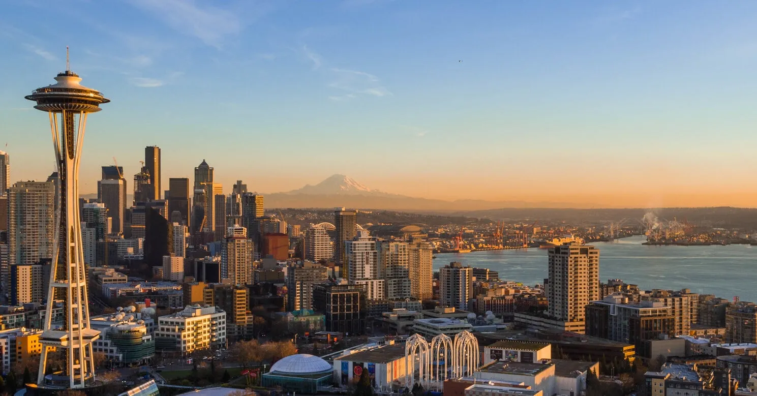 Seattle skyline with the Space Needle in the foreground and Mount Rainier in the distance