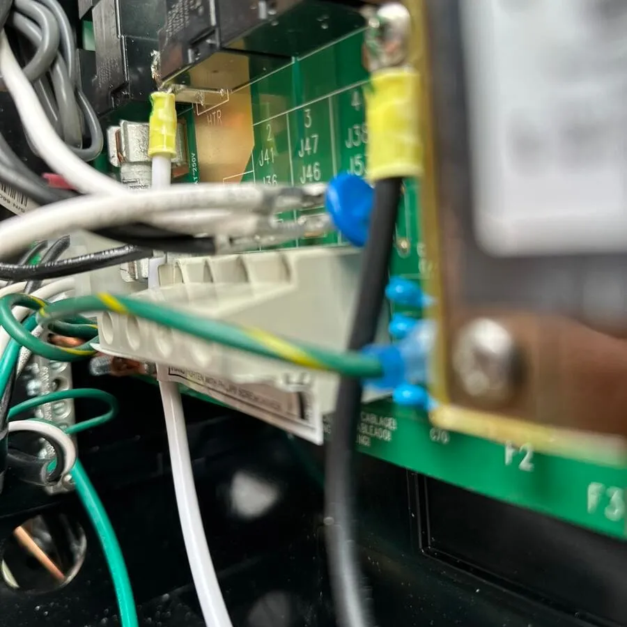 Close-up of the wiring landed inside a hot tub controller