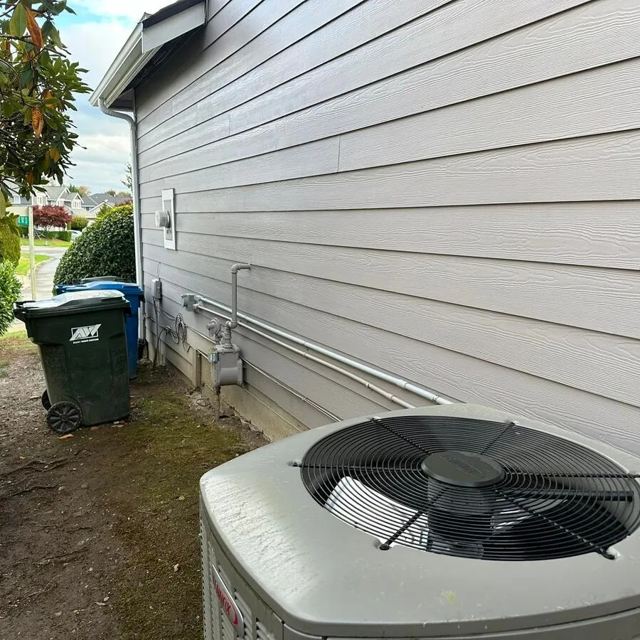 Conduit run carrying the hot tub circuit from the panel around the side of the house