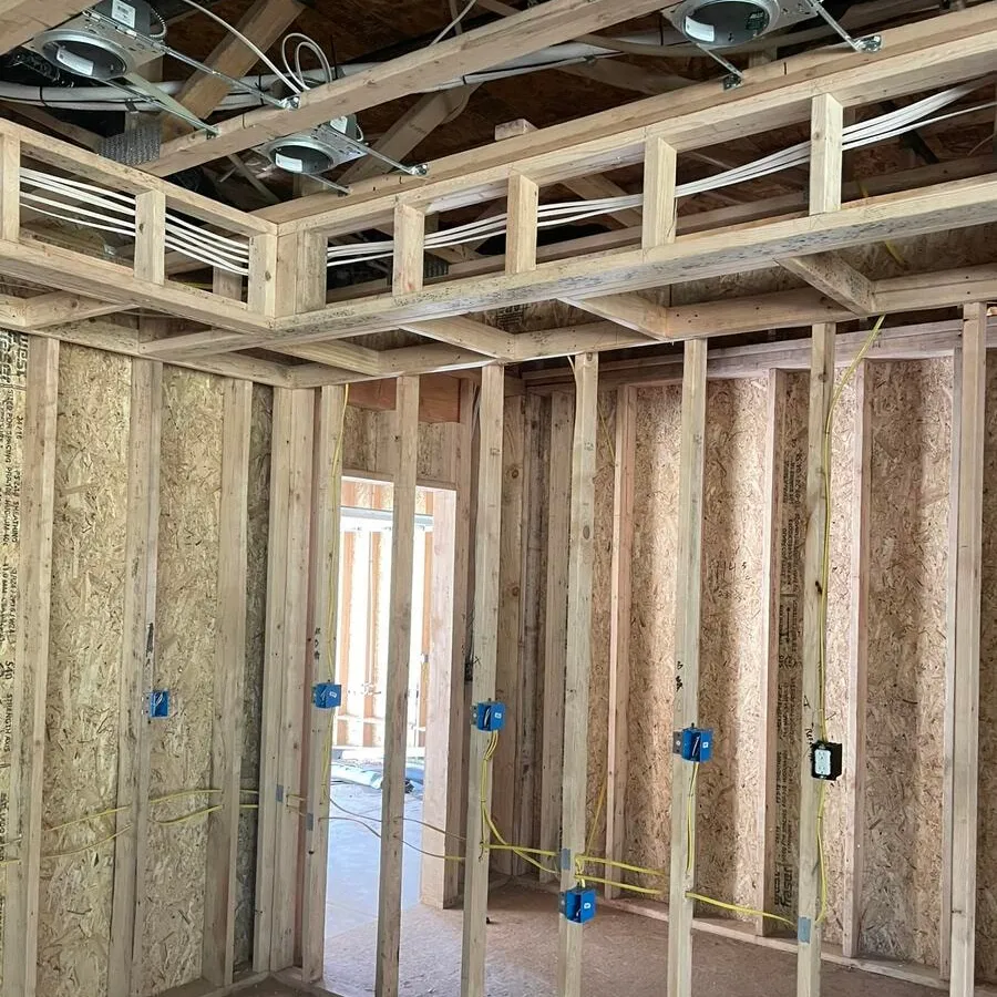 Home run wiring gathered through the framing of a house under construction
