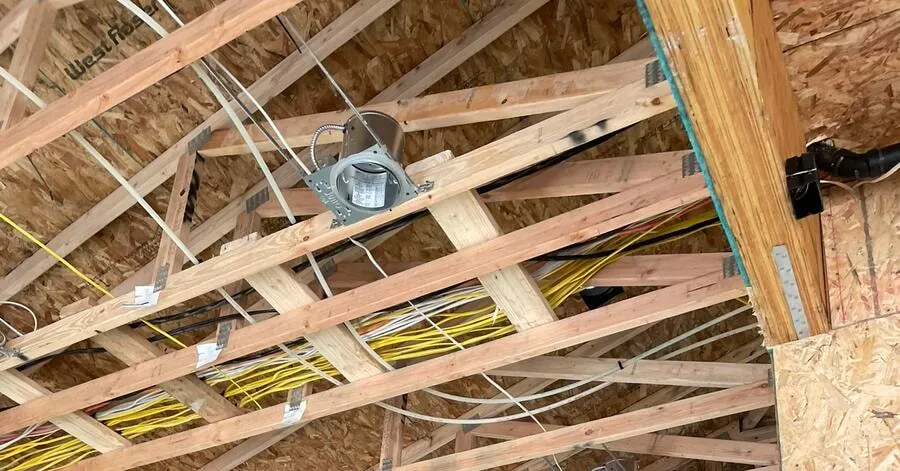 Every recessed can in a new build room wired and ready for drywall