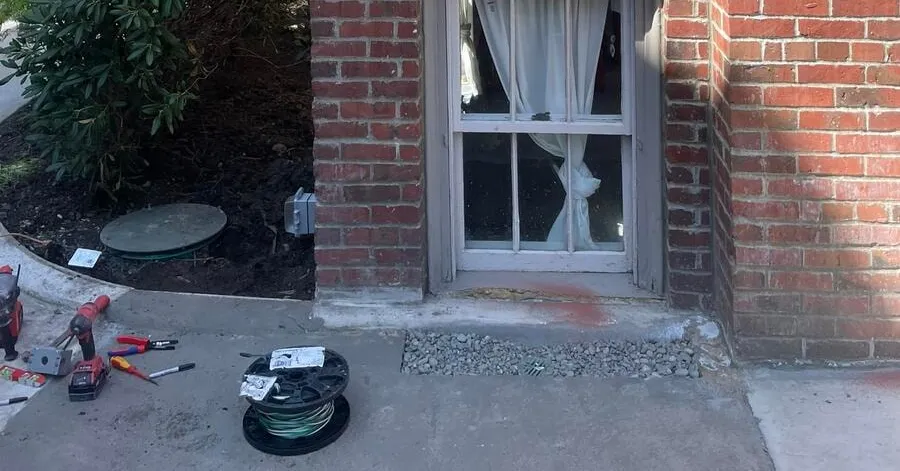 Conduit leaving the septic controls, starting its run along the building toward the panel