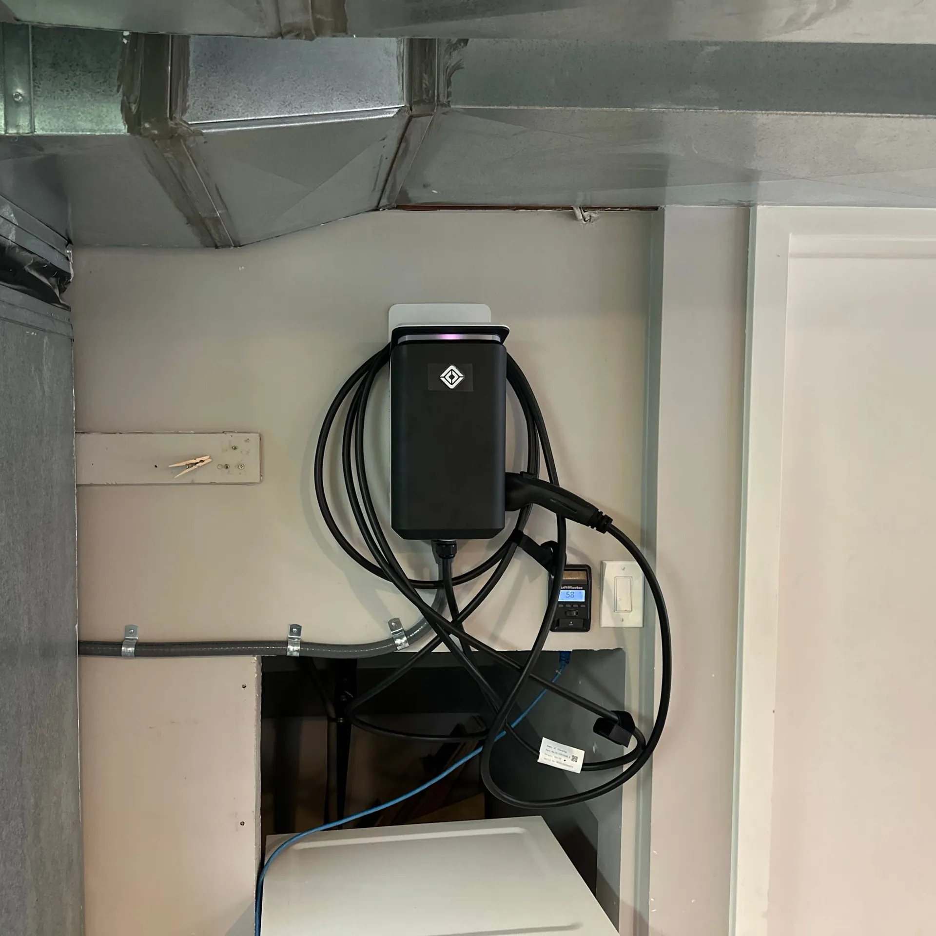 Rivian Wall Charger installed on a garage wall
