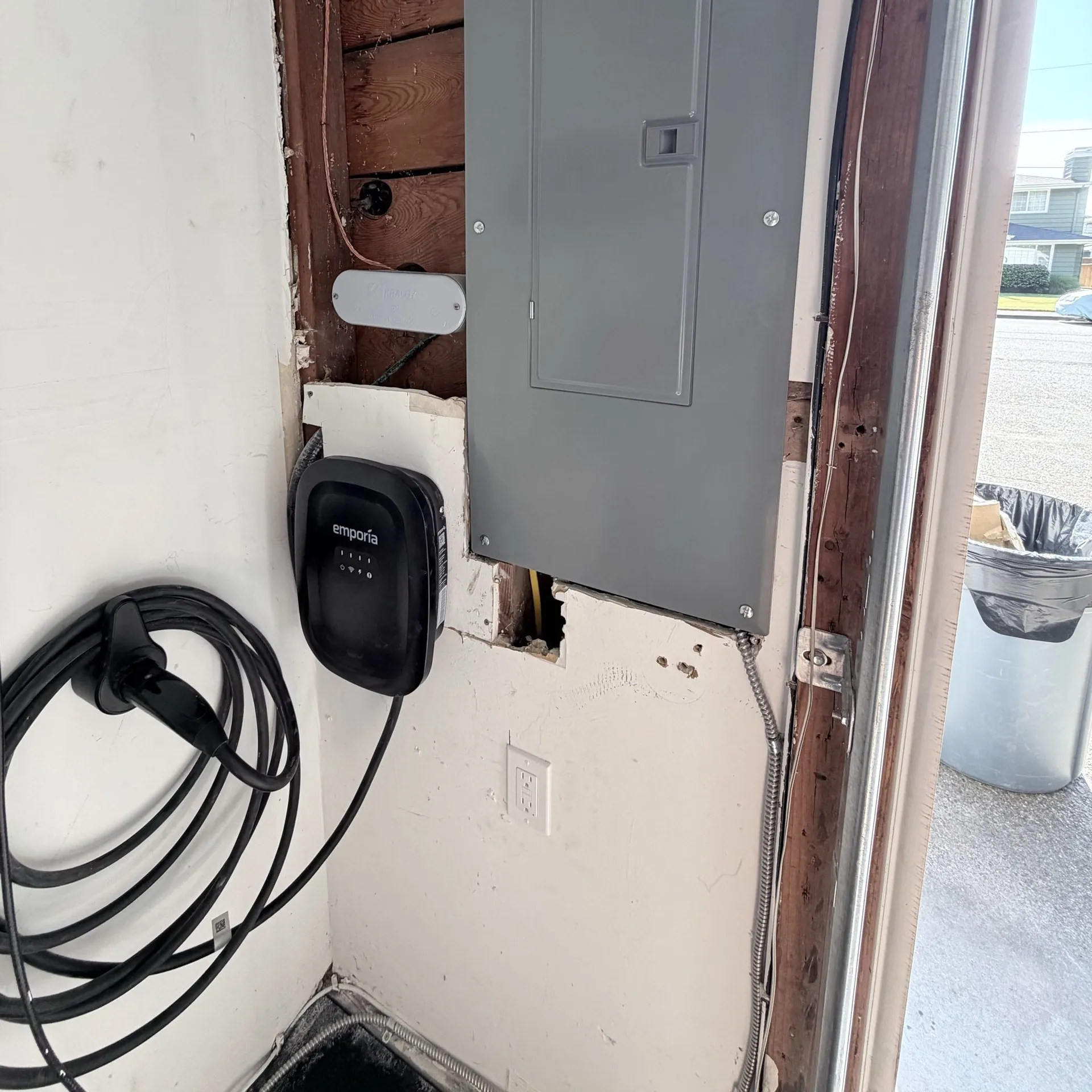 Emporia EV charger installed next to the upgraded electrical panel