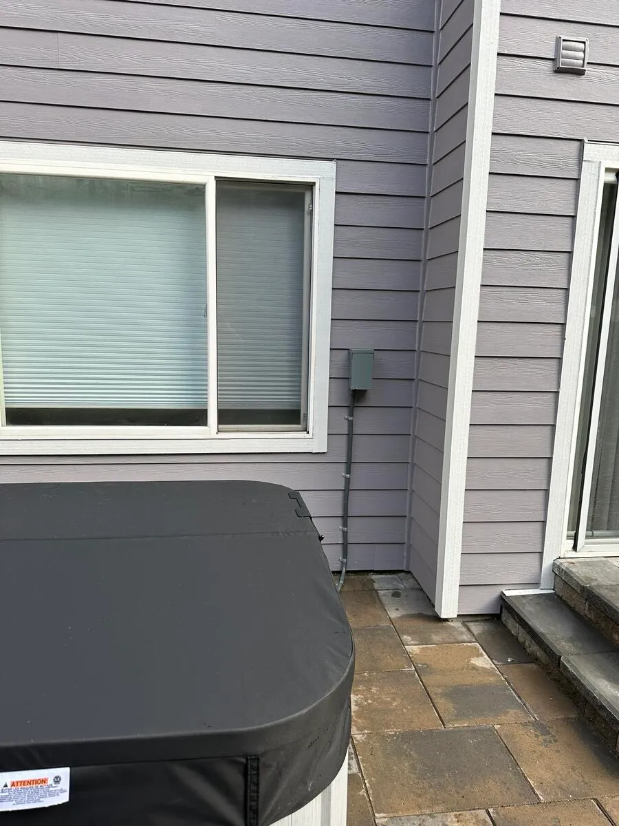 Completed hot tub electrical installation with disconnect switch