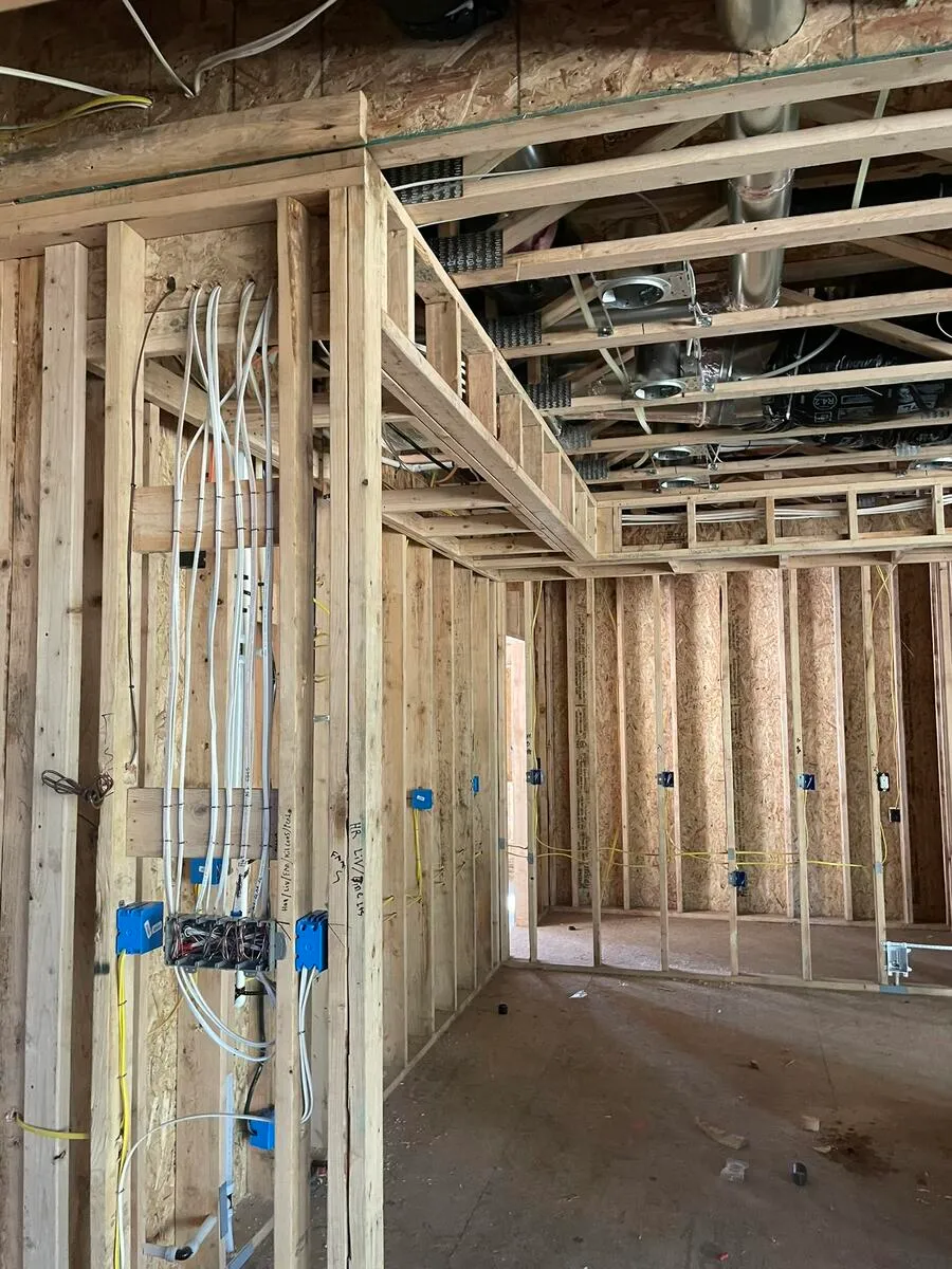 Wiring routed through walls in the second room