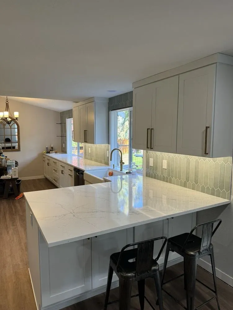 Finished kitchen with under-cabinet LED lighting washing the backsplash