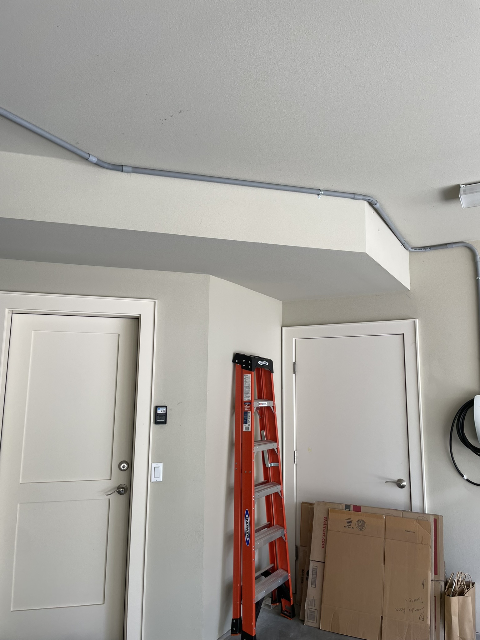 Conduit routed along the exterior wall